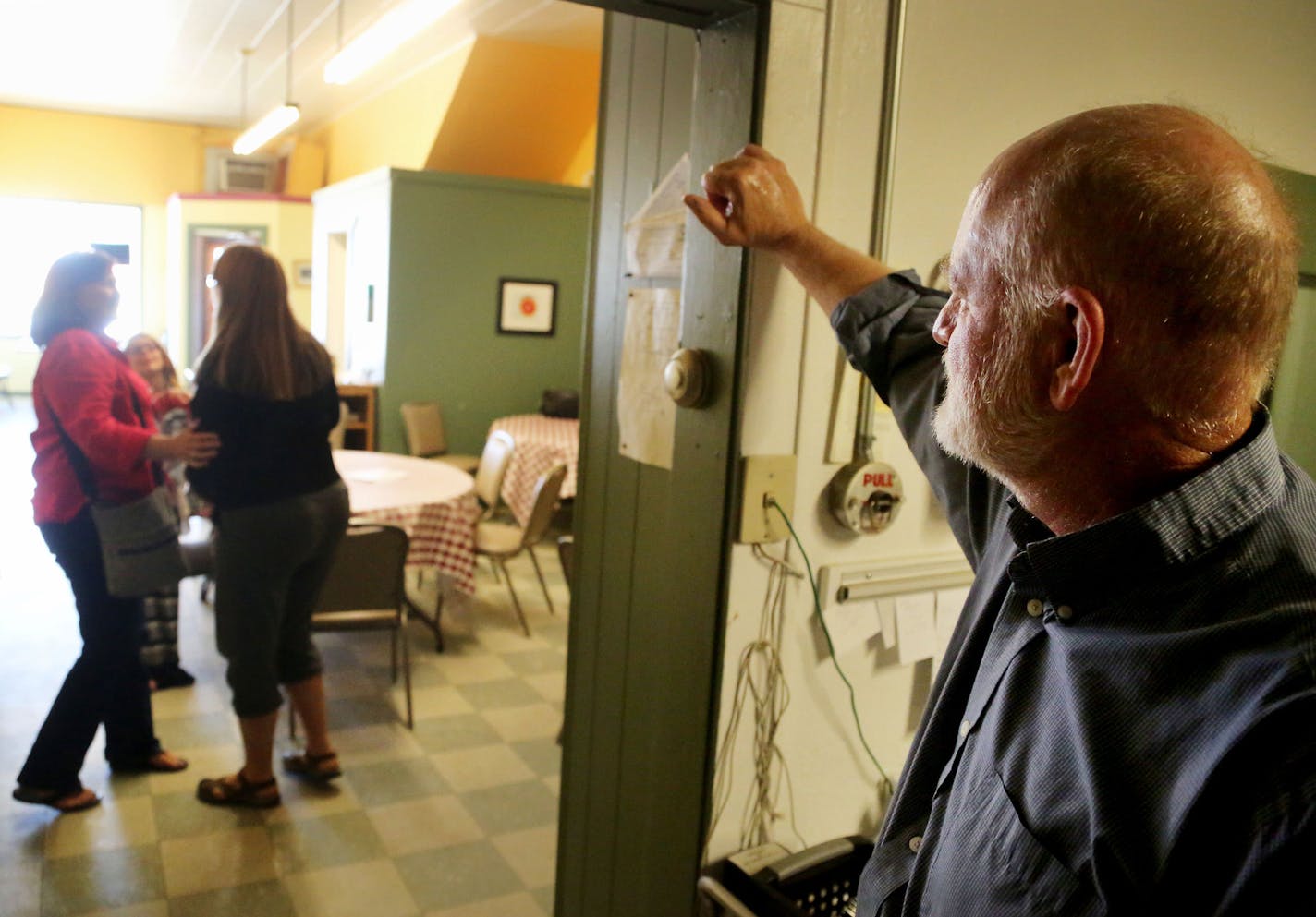 Past the Inadvertent Cafe's 10 a.m. closing, owner and cook Brent Olson stands quietly in the kitchen watching customers say a slow goodbye to one another after one of Olson's five dollar menu items and a heaping of hospitality and camaraderie Wednesday, June 8, 2016, in Clinton, MN. When the customers were slow to leave the cafe, the only one within a hundred or more mile radius with crepes on the menu some brag, Olson's only request was for the last one out to close the back door on the way ou