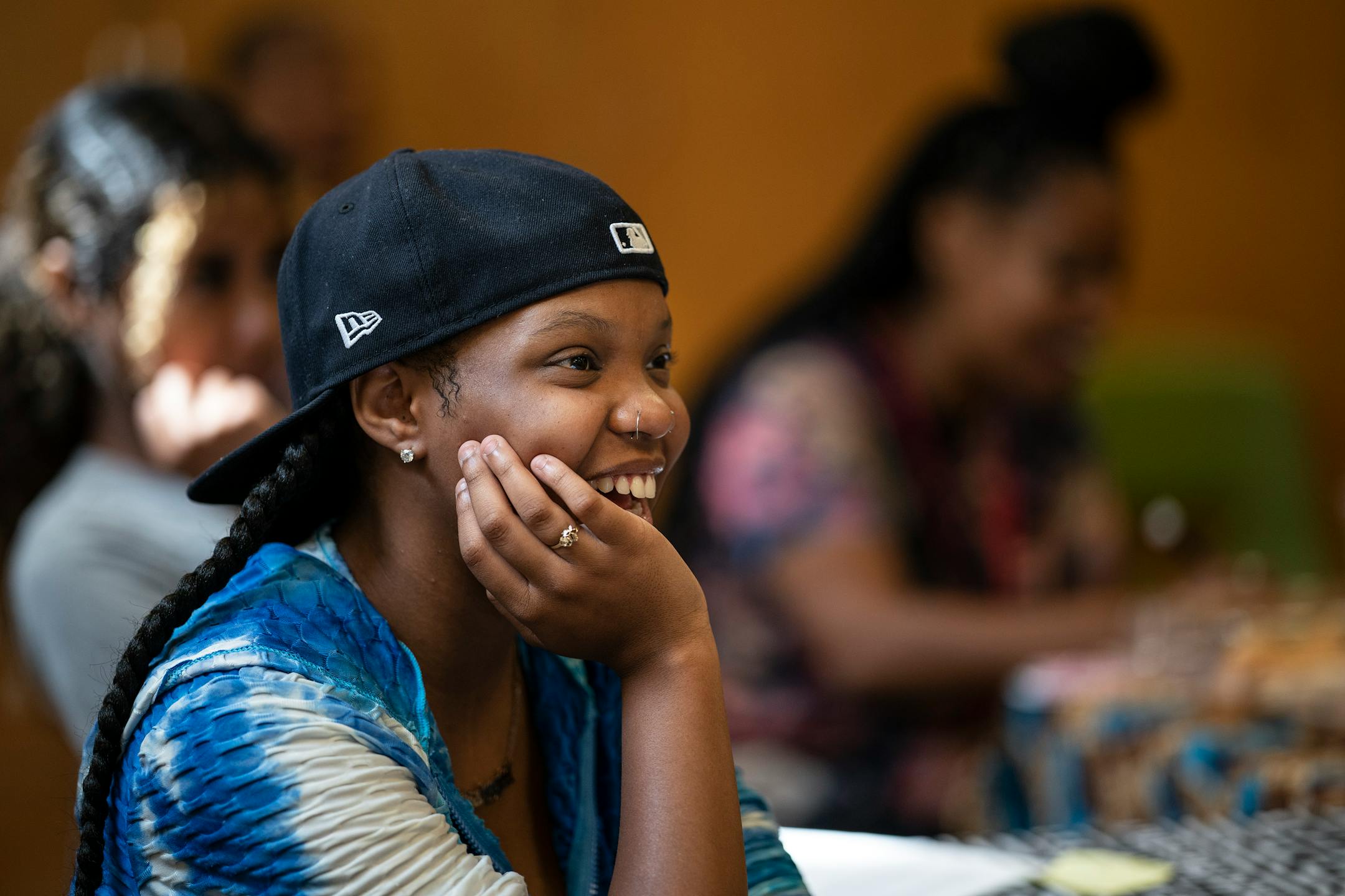 Sanaa Wilder a summer school student at Edison High listened as Vusumuzi Zulu a Black Storyteller spoke .