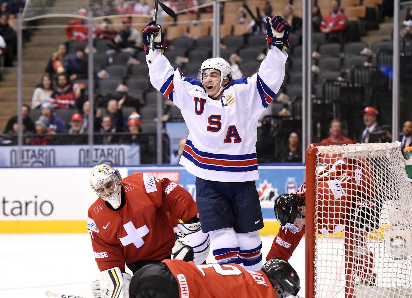 Wild prospect Luke Kunin celebrated his goal scored on Swiss goalie Joren van Pottelberghe during the first period of a quarterfinal hockey game at the world junior championship.