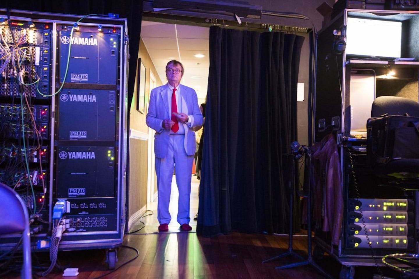 Garrison Keillor waits to walk onstage after the live broadcast ended to sing a few more songs with the audience.