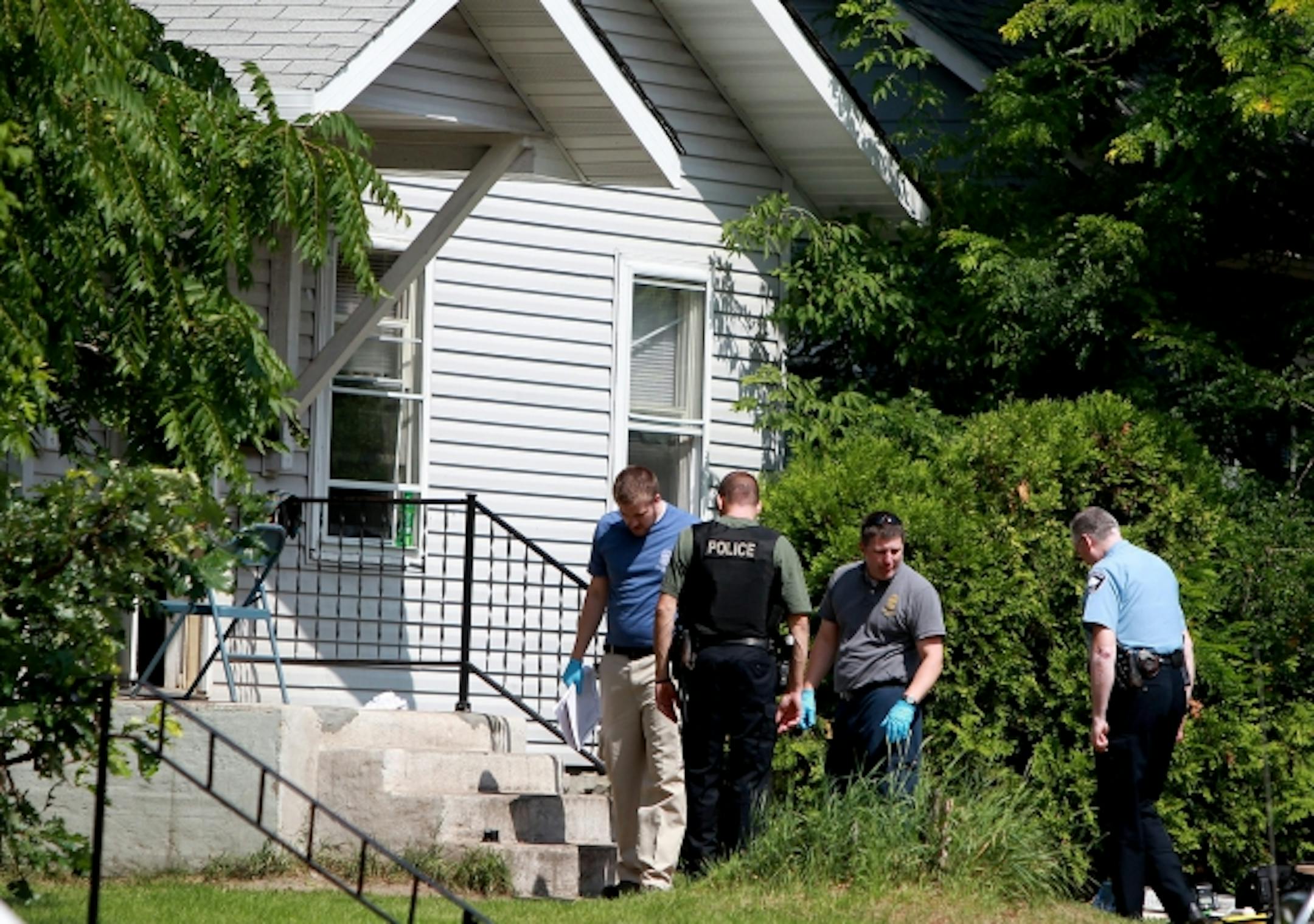 Police look over the crime scene Tuesday morning