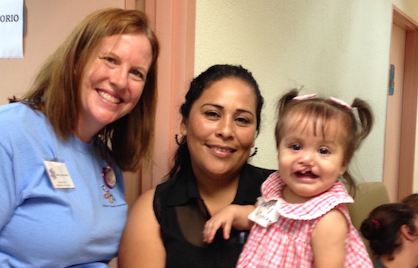 Photo by Melanie McCall: On screening day, the team registered and examined 98 children and their parents. Nearly 50 were chosen for surgery.This little girl had cleft lip surgery the next morning.