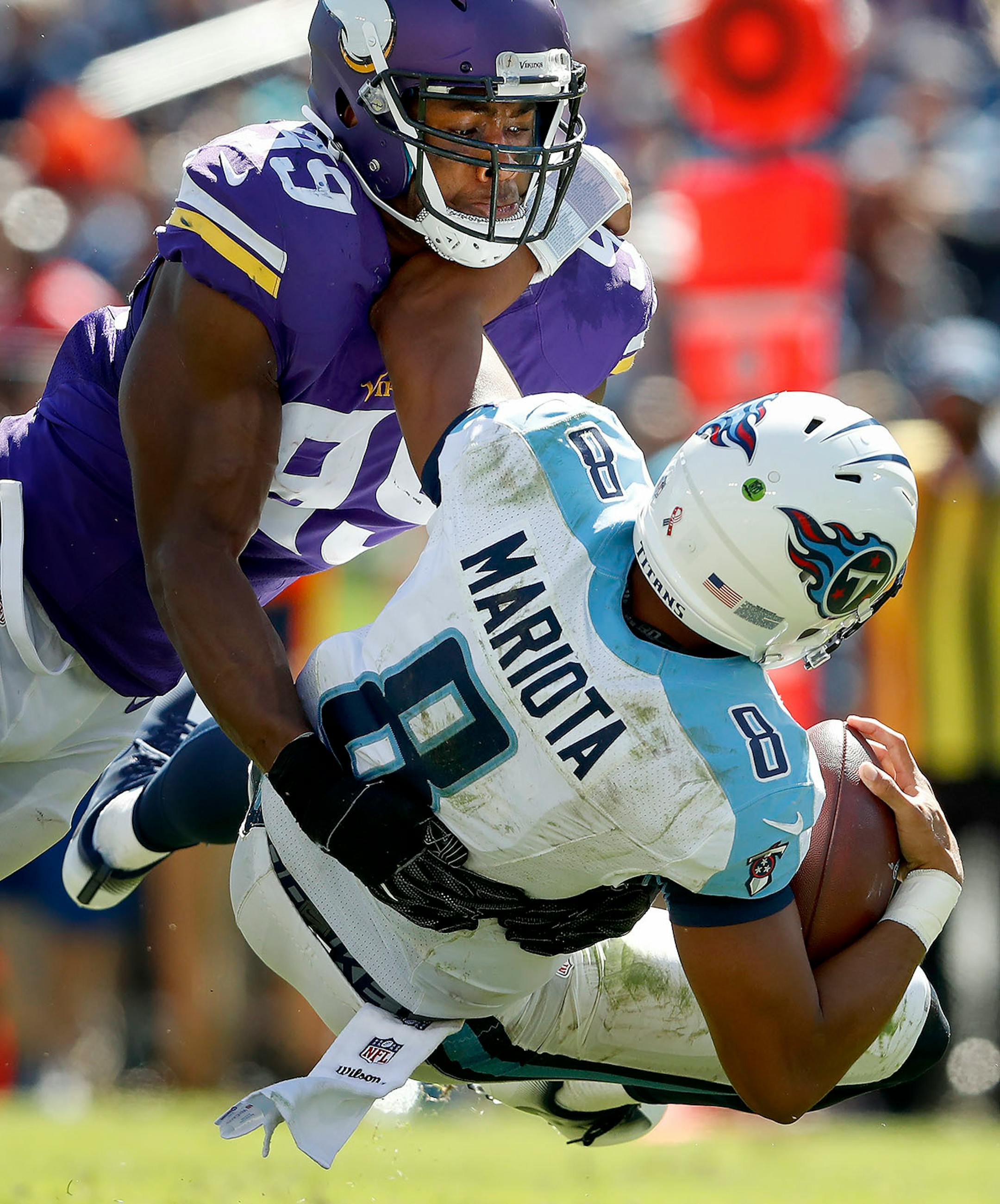 Danielle Hunter (99) sacked Marcus Mariota in the fourth quarter.