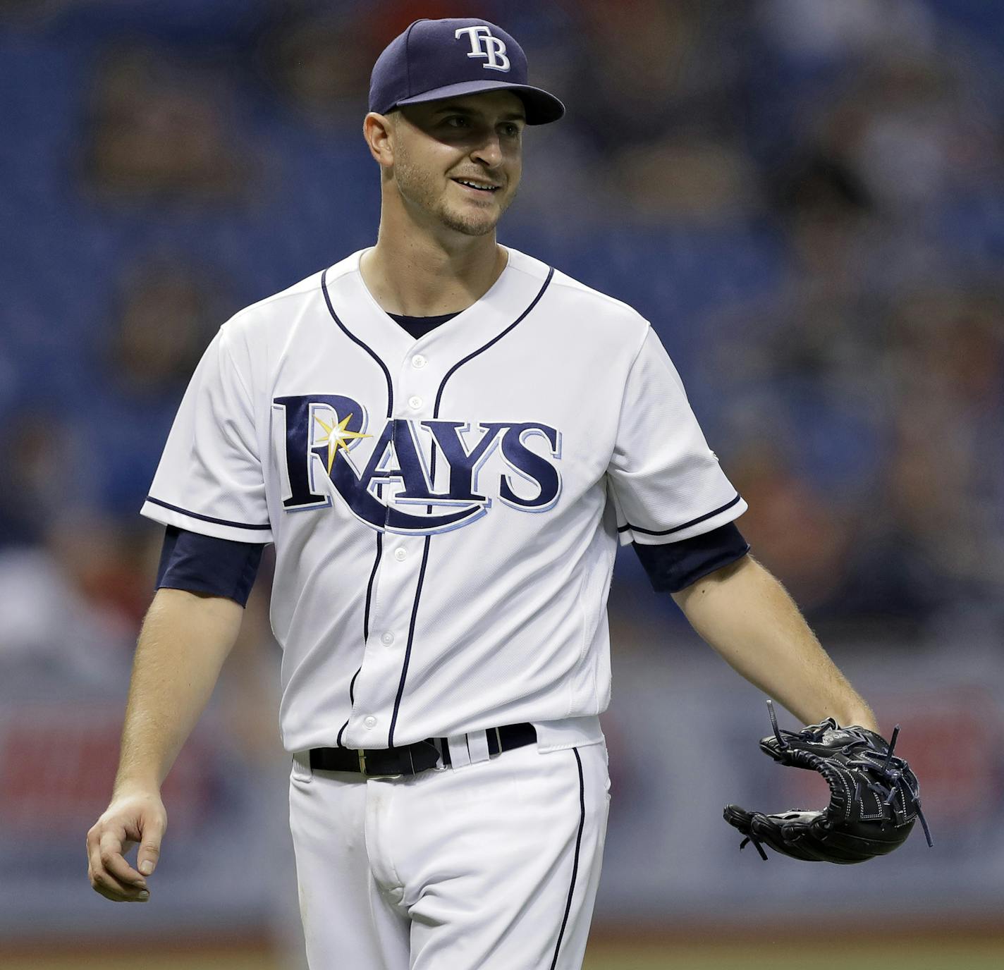 Tampa Bay Rays starting pitcher Jake Odorizzi smiles at Minnesota Twins' Joe Mauer after Mauer broke up Odorizzi's no-hit bid with a single during the seventh inning of a baseball game Tuesday, Sept. 5, 2017, in St. Petersburg, Fla. (AP Photo/Chris O'Meara)