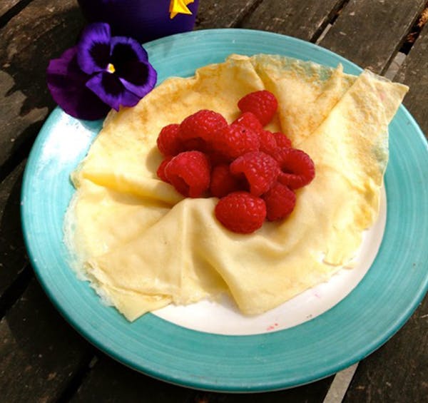 Credit: Nell Pierce Open crepes with raspberries.