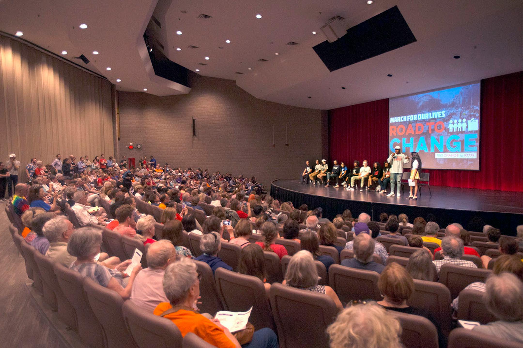 The audience listens as the speakers begin the panel with a moment of silence for Thurman J. Blevins who died on Saturday evening after being shot by Minneapolis police.