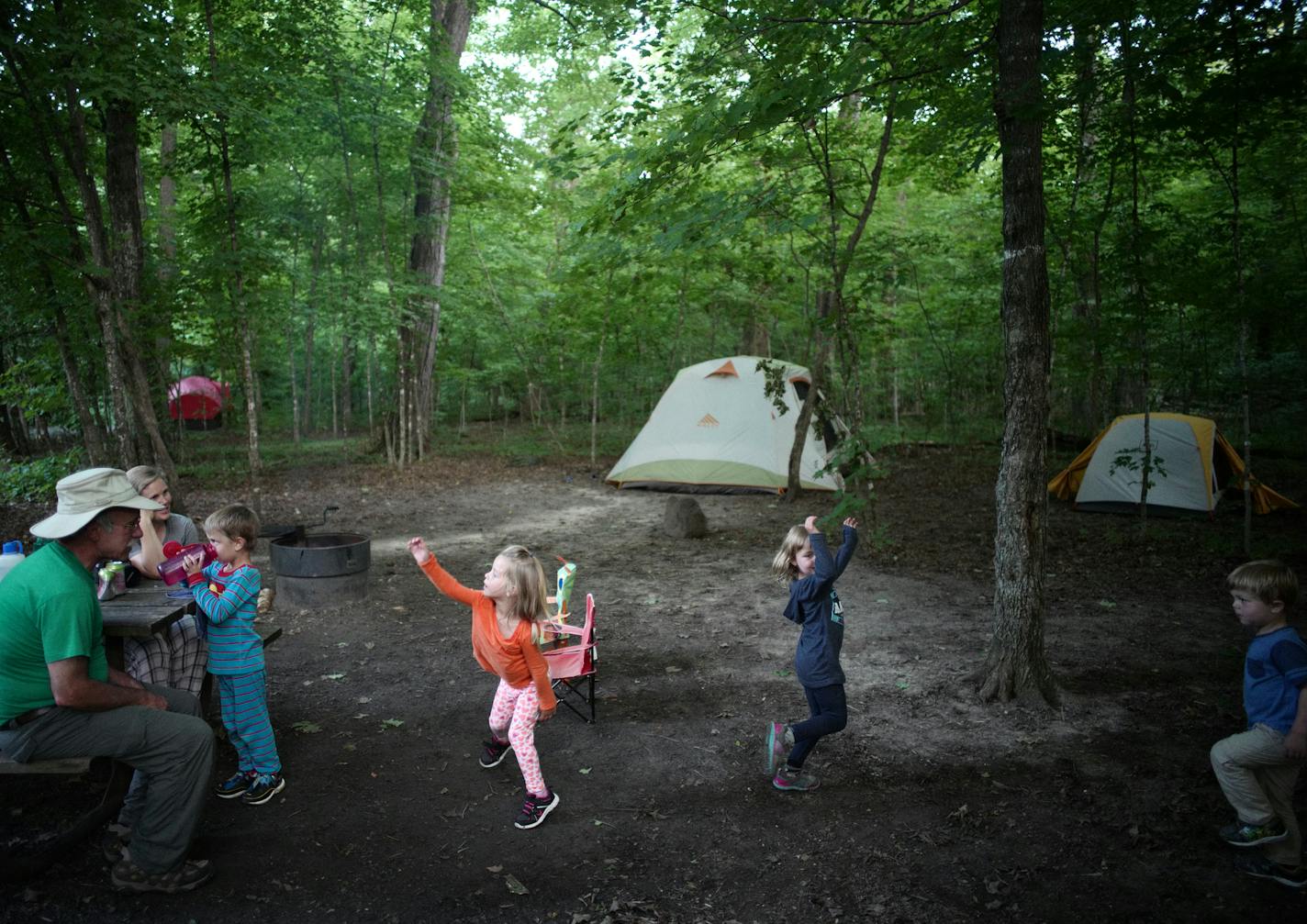 Grandchildren Gus Haschig,5,takes a sip of water as sister Lydia,3, cousins Hannah and Daniel Malkovich,5 and 3, perform some expressive dancing for grandfather Dan Malkovich.] At William O'Brien State Park exemplifies camping's popularity across the state ballooning as more Minnesotans seek inexpensive, close-to-home vacations and experience the mental and physical health benefits of spending time in nature. Richard Tsong-Taatarii/Richard Tsong-taatarii@startribune.com