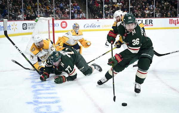Minnesota Wild right wing Mats Zuccarello (36) took control of the puck after it was lost by defenseman Brad Hunt (77) in the second period. ] Aaron L