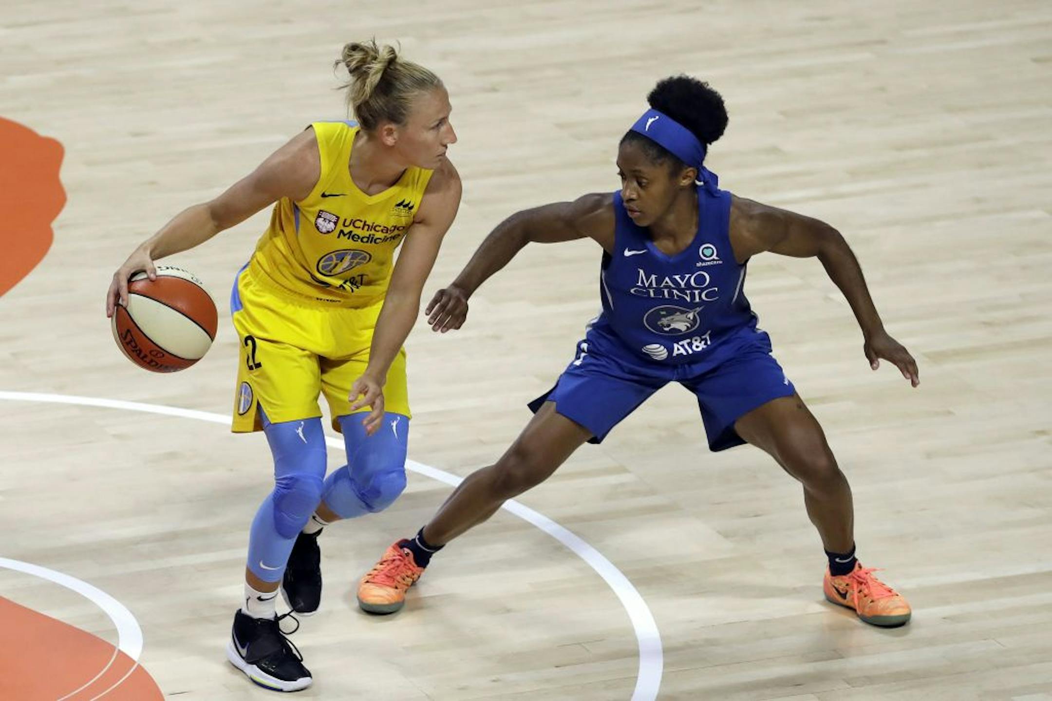 Chicago Sky guard Courtney Vandersloot (22) works against Minnesota Lynx guard Crystal Dangerfield (2) during the first half of a WNBA basketball game Thursday, July 30, 2020, in Bradenton, Fla.