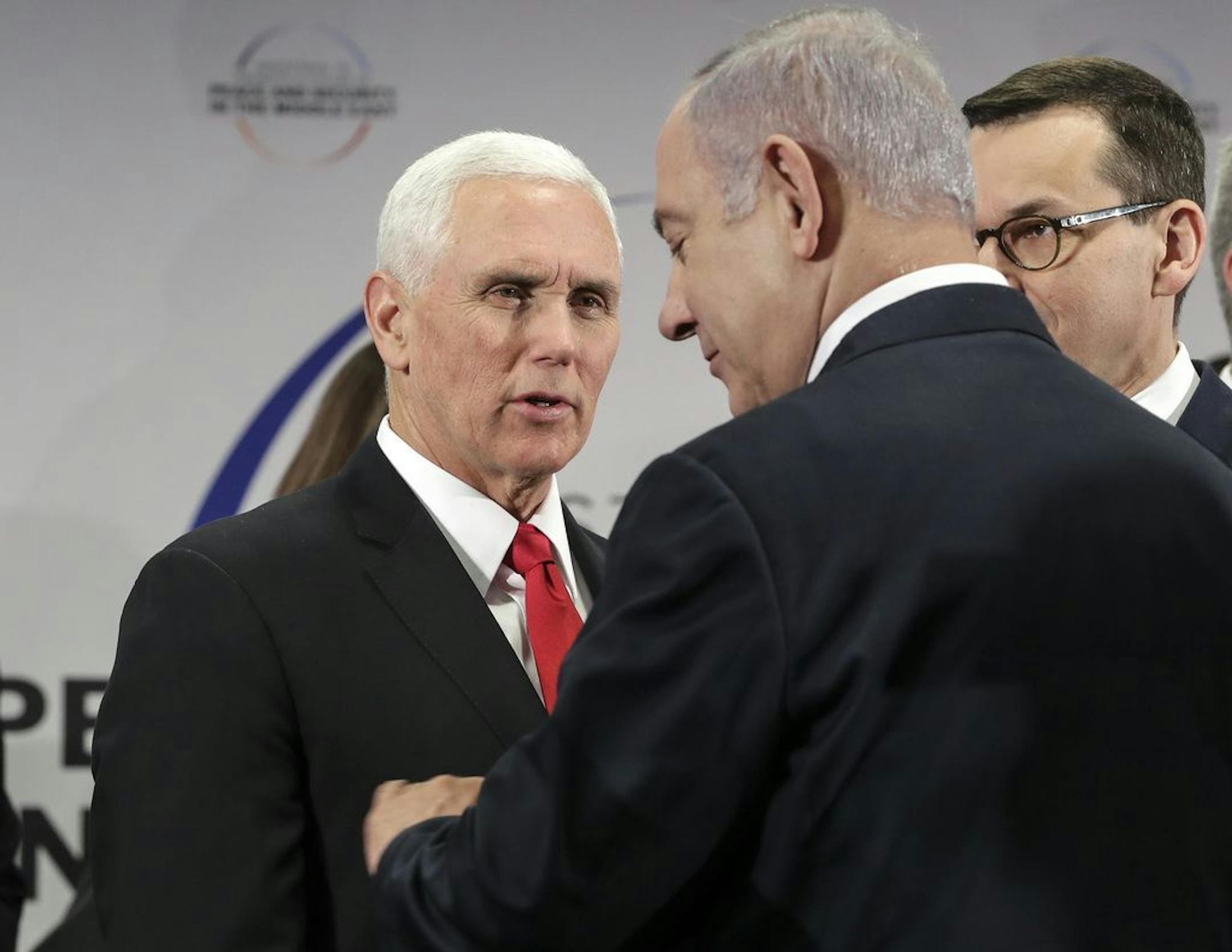 United States Vice President Mike Pence, left, speaks to Israeli Prime Minister Benjamin Netanyahu during a conference on Peace and Security in the Middle East in Warsaw, Poland, Thursday, Feb. 14, 2019.