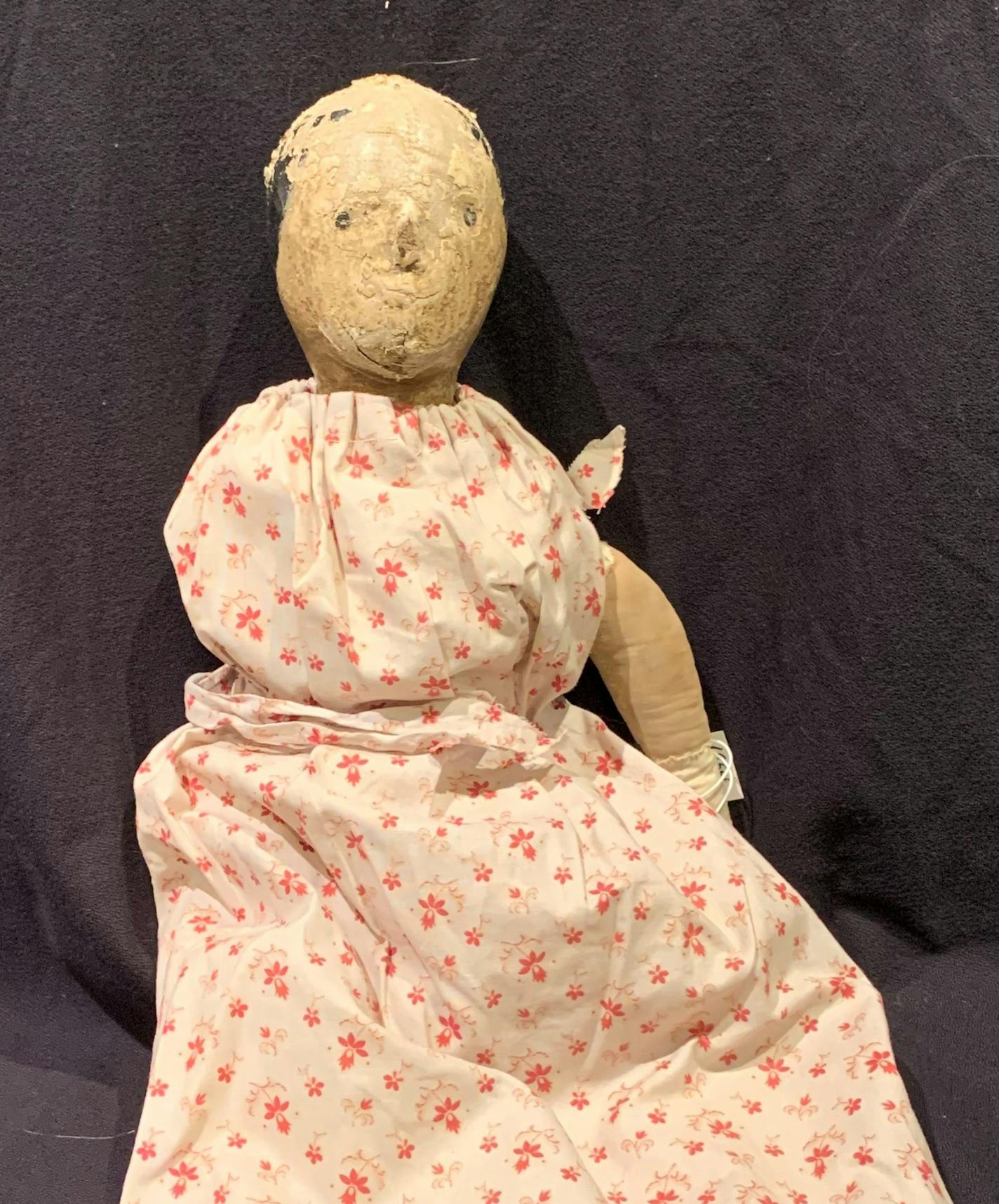 This doll once may have been beautiful, but age and use have mummified it.