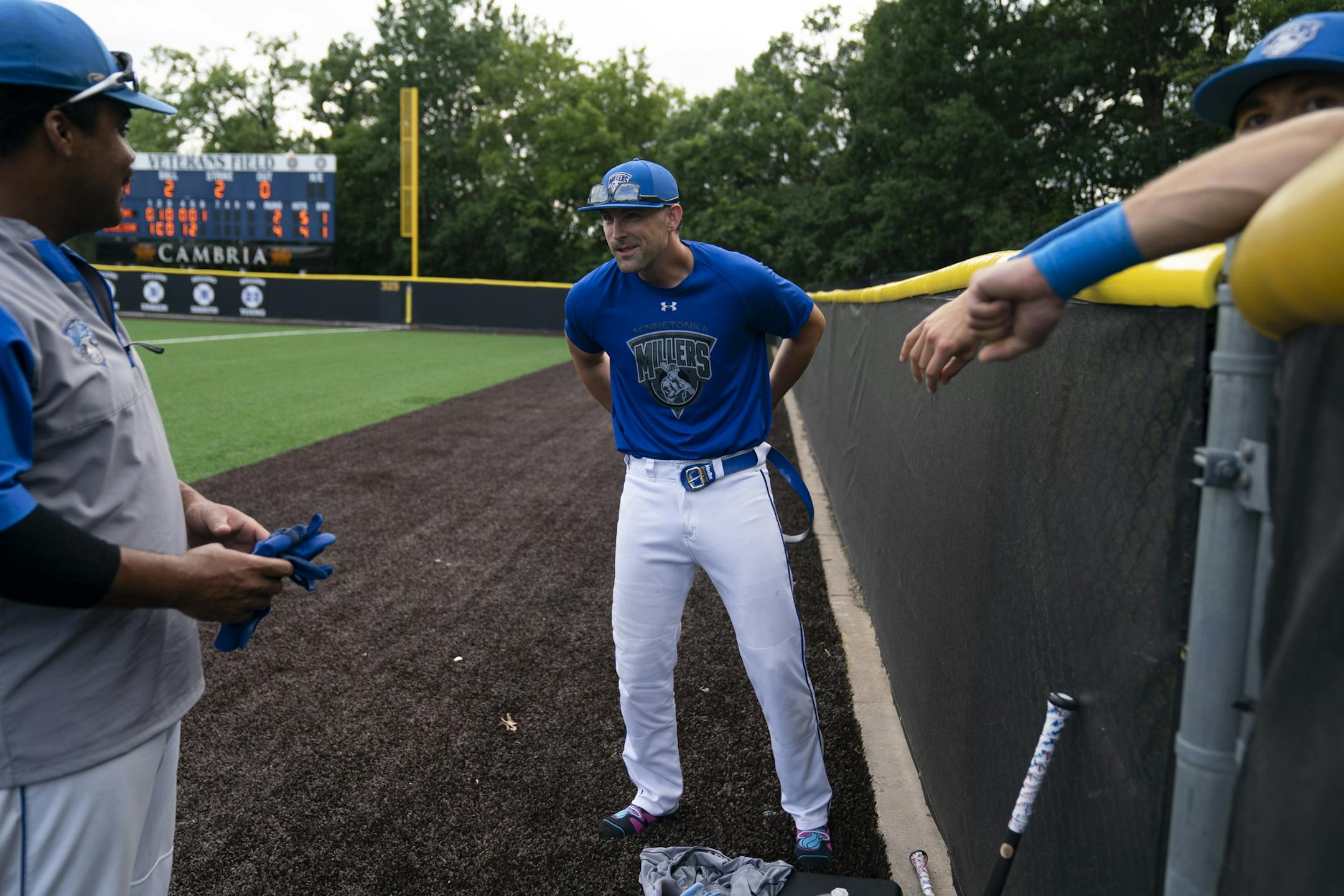 Minnetonka Millers player Joe Shallenberger laughed with teammate Mike Davis, at left, as he got his uniform on before a game at Veteran's Field in Minnetonka, Minn., on Monday, July 6, 2020. ] RENEE JONES SCHNEIDER renee.jones@startribune.com