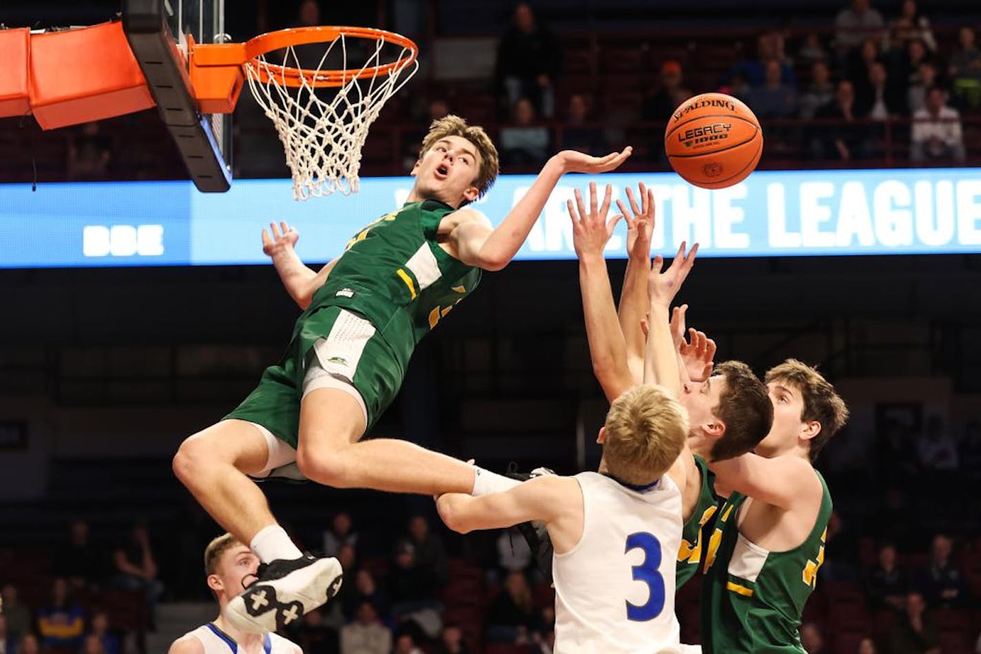 Erick Reader (31) reaches for the ball after missing a dunk in the final minutes of the game. New Life Academy fell to Belgrade-Brooten-Elrosa 55-53 in their Class 1A semi final matchup at Williams Arena. Photo by Cheryl A. Myers, SportsEngine