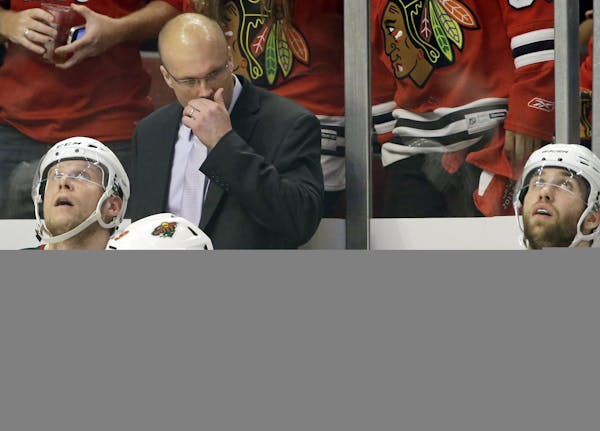 Minnesota Wild head coach Mike Yeo watches his team during the second period of Game 5.