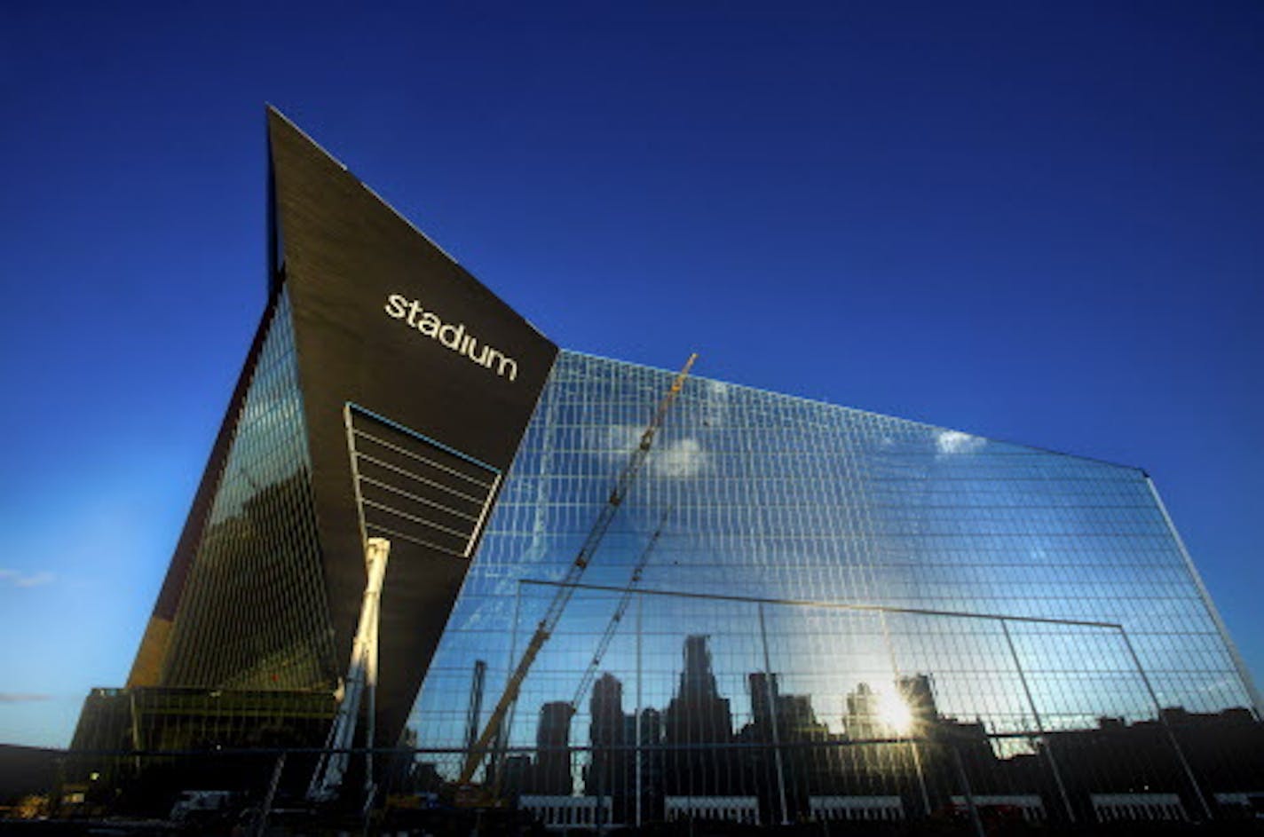 The Minneapolis skyline is reflected in U.S. Bank Stadium, under construction in downtown Minneapolis.