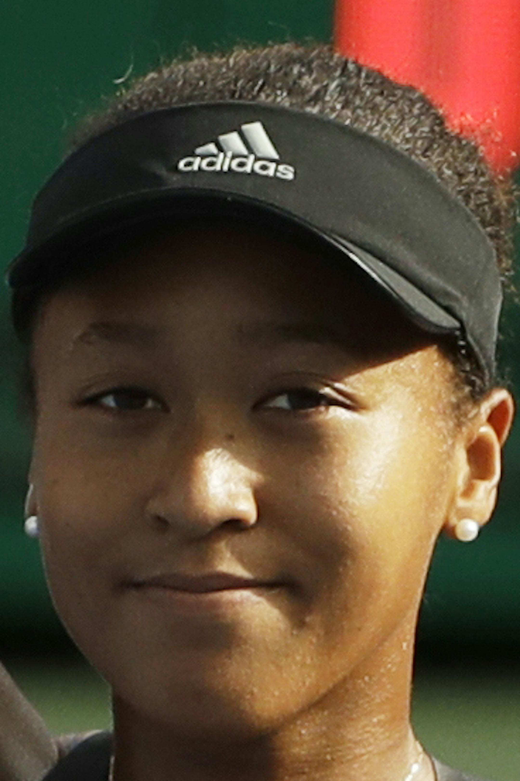 Naomi Osaka, of Japan, waves to fans after defeating Aliaksandra Sasnovich, of Belarus, during the third round of the U.S. Open tennis tournament, Saturday, Sept. 1, 2018, in New York. (AP Photo/Kevin Hagen)
