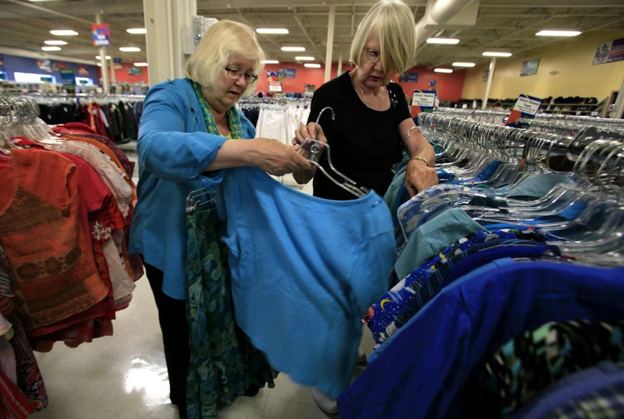 Beth Glasoe (left) from California, was visiting Sue Maki of Chaska, MN, go to the thrift stores after lunch every time Beth visits the Twin Cities. On June 20th they made a stop at the Goodwill store in Bloomington, Mn to look for a skirt and blouse. June 20, 2012.