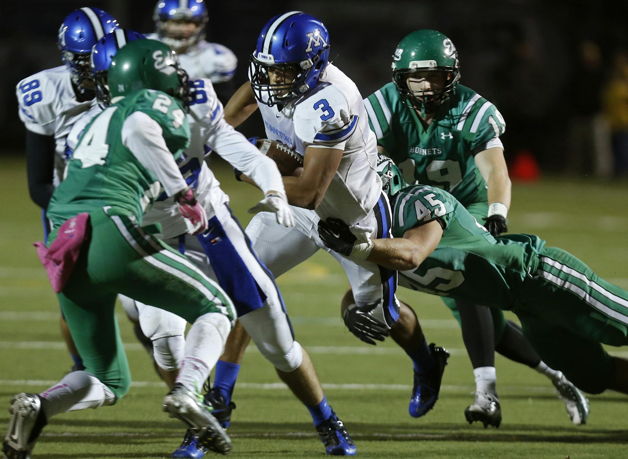 At Kuhlman Field in Edina, in the class 6A football playoff game between Edina and Minnetonka High Schools, Jason Witherspoon(3) sought the open field as Colin Ritter(45) of Edina tackled him .]richard tsong-taatarii/rtsongtaataarii@startribune.com ORG XMIT: MIN1310252026422795