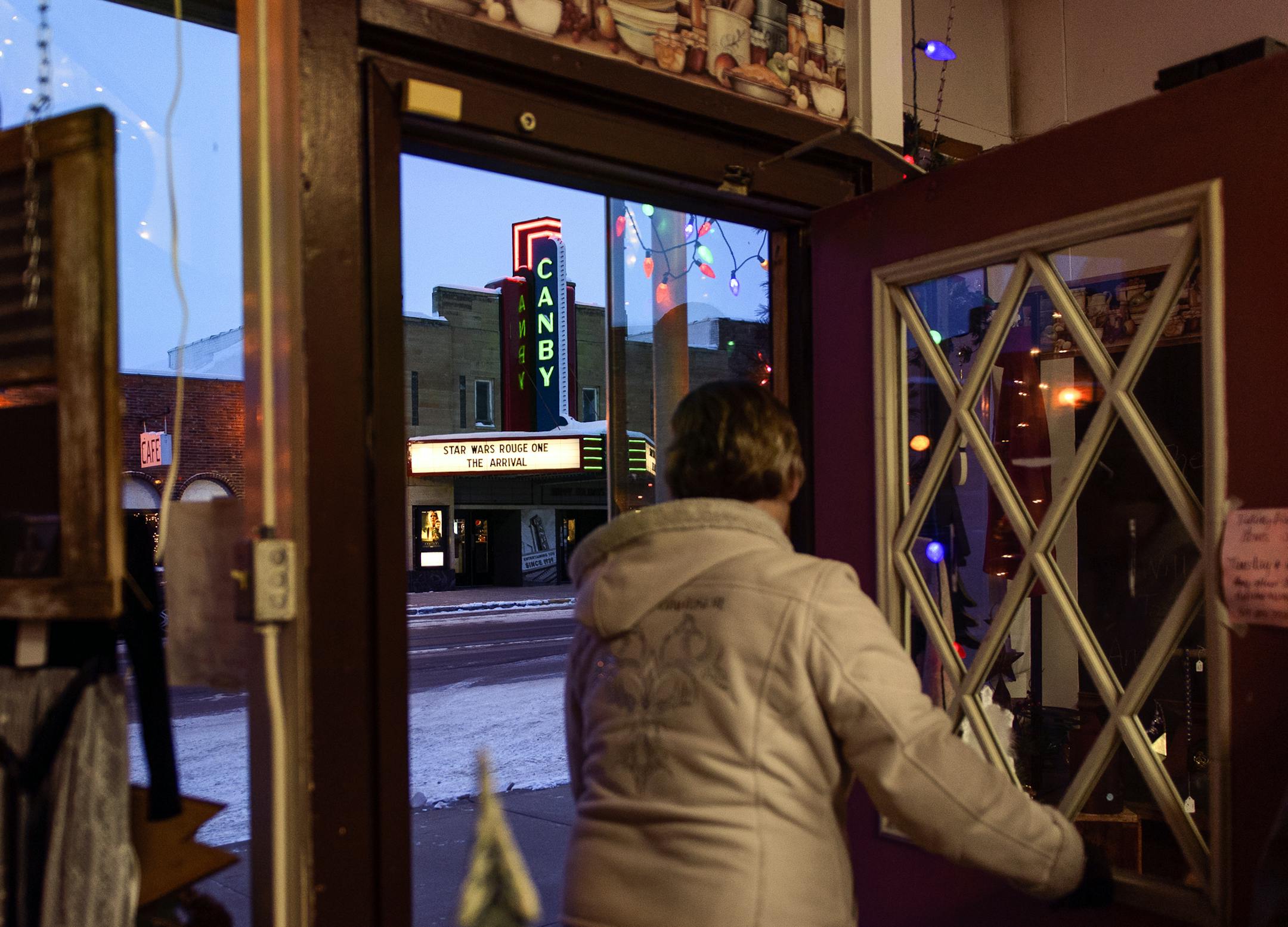 Mary Homan opened the door of "Delightful Treasures," a business located across the street from the Canby Classic Cinema, Thursday night. ] (AARON LAVINSKY/STAR TRIBUNE) aaron.lavinsky@startribune.com When the Canby movie theater closed five years ago, residents feared that the empty building would symbolize a dying town. So they launched an effort to raise $300,000 to renovate and reopen the theater. They succeeded. We visit the theater on the opening night of Rogue One on Thursday, Dec. 15, 20