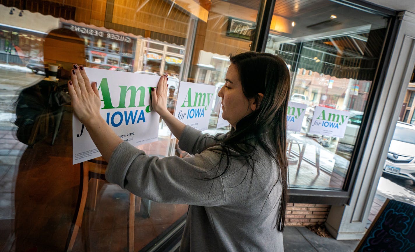 Amy Klobuchar staffer Hannah McDonald prepped a Main Street coffee shop in Ames, Iowa for the arrival of St Paul Mayor Melvin Carter and Duluth Mayor Emily Larson to stump for Klobuchar who is stuck in Washington, D.C.