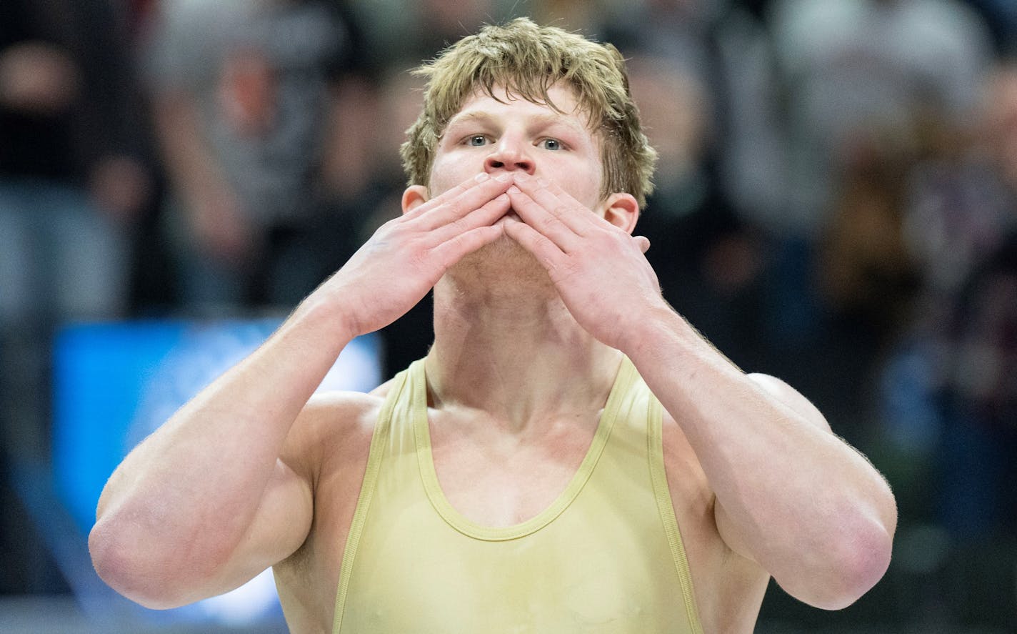 Waconia wrestler Max McEnelly celebrates after defeating Stillwater wrestler Ryder Rogotzke in the Class 3A 195lb weight class to win his fourth state championship during the MSHSL wrestling state tournament championships Saturday, March 4, 2023 at Xcel Energy Arena in St. Paul, Minn. ]