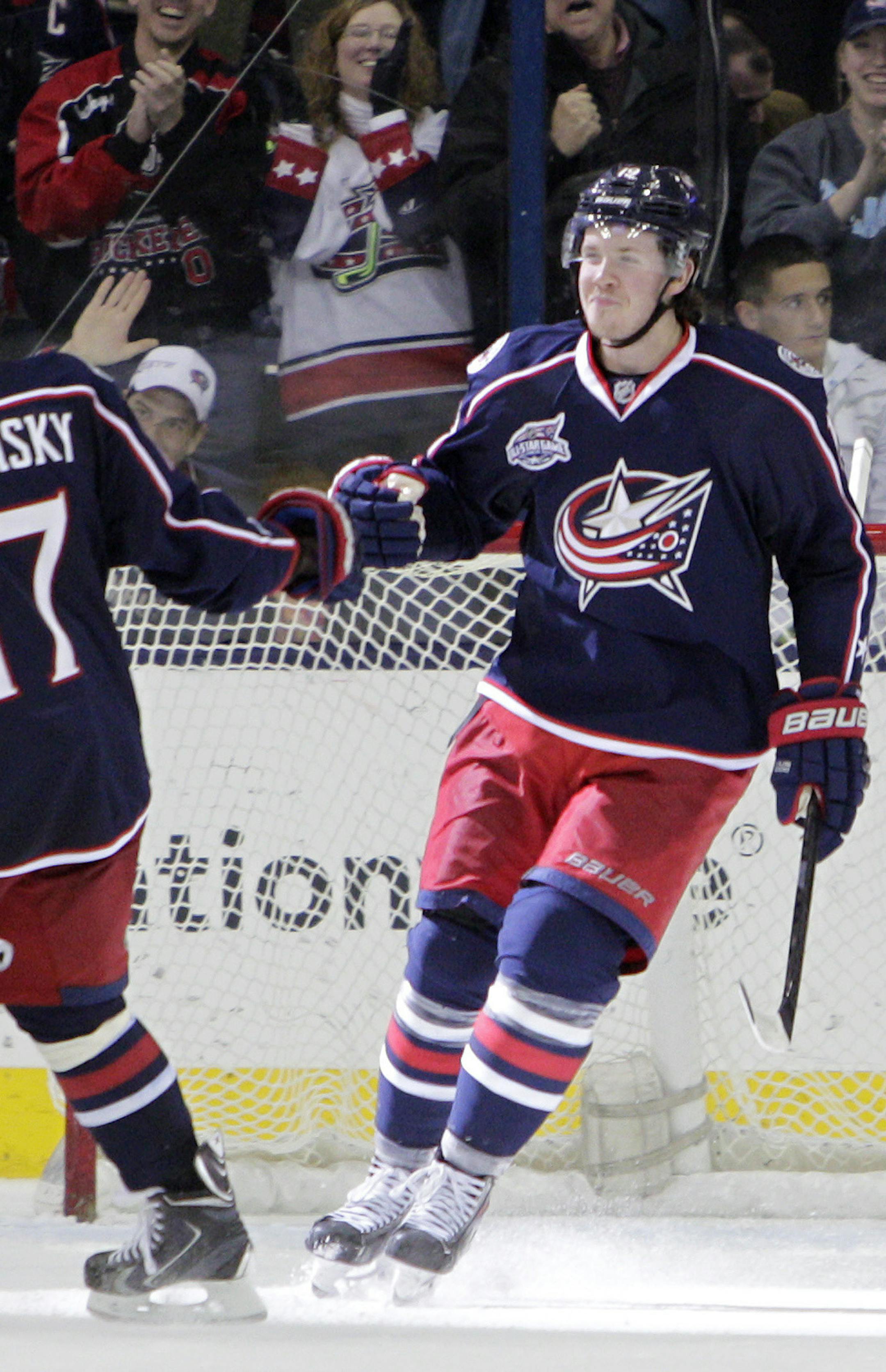 Columbus Blue Jackets' Ryan Johansen, right, celebrates his goal against the Minnesota Wild with Brandon Dubinsky during the third period of an NHL hockey game Wednesday, Dec. 31, 2014, in Columbus, Ohio. The Blue Jackets won 3-1. (AP Photo/Jay LaPrete)