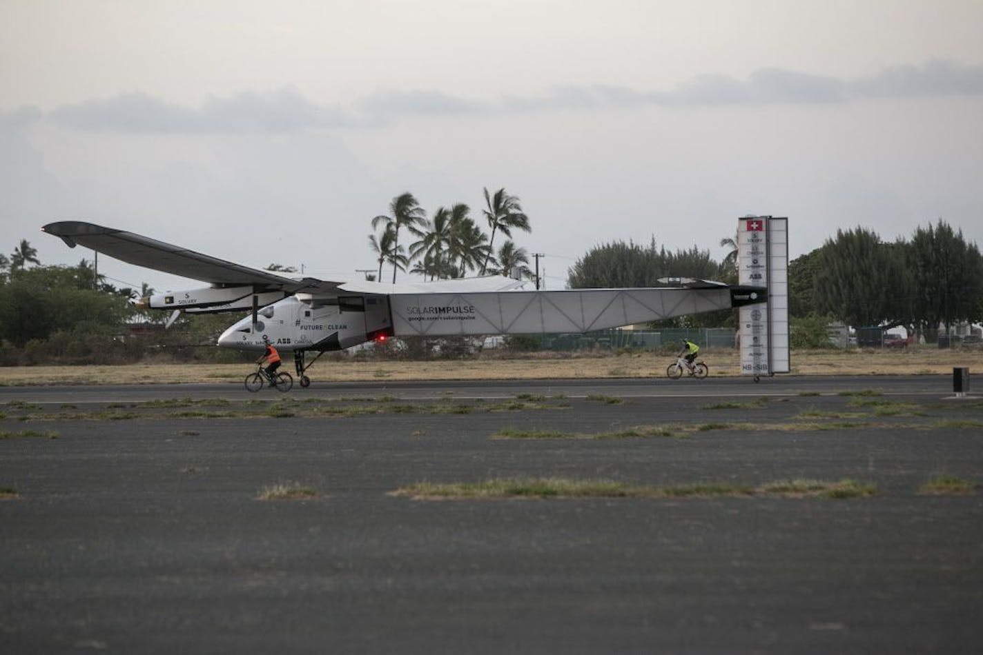 The Solar Impulse 2, a solar-powered airplane, lands at the Kalaeloa Airport, Friday, July 3, 2015 in Kapolei, HI. The plane, piloted by Andre Borschberg, is attempting to fly around the world without fuel.