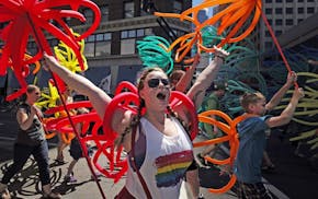 At the 2014 Pride Parade in downtown Minneapolis, Tiffany Ashmead walked with friends.