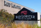 Signs for a Red Lobster restaurant are shown in San Bruno, Calif., Tuesday, May 14, 2024. Red Lobster has filed for Chapter 11 bankruptcy protection d