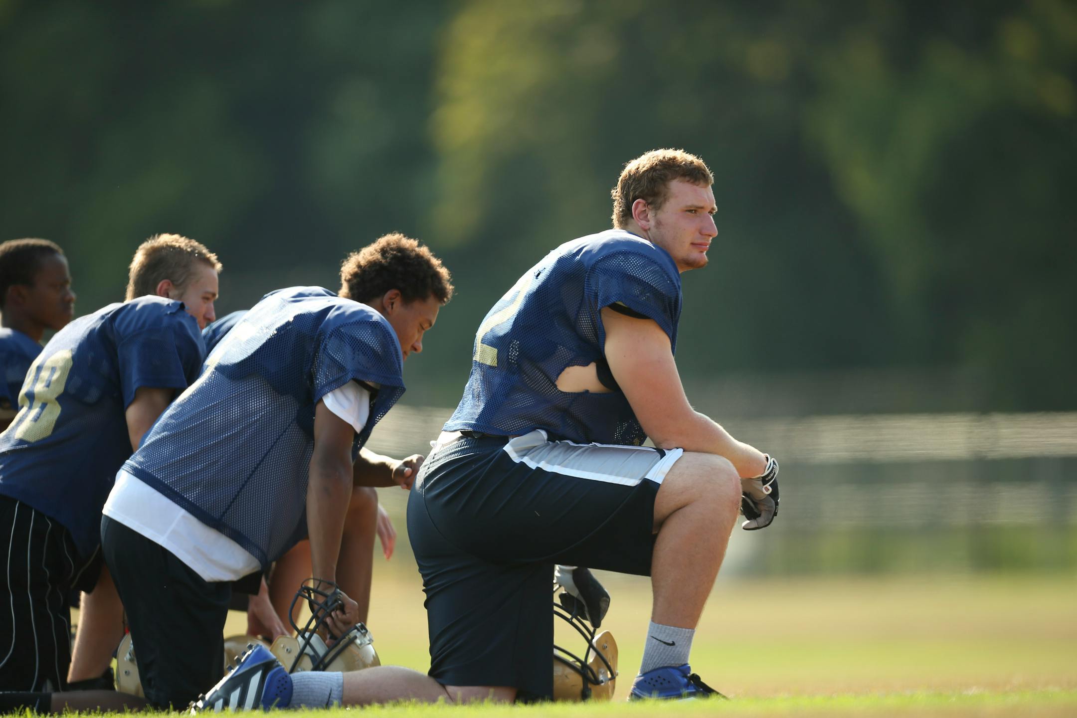 Frank Ragnow on the sidelines with teammates during Chanhassen's football practice September 5, 2013.