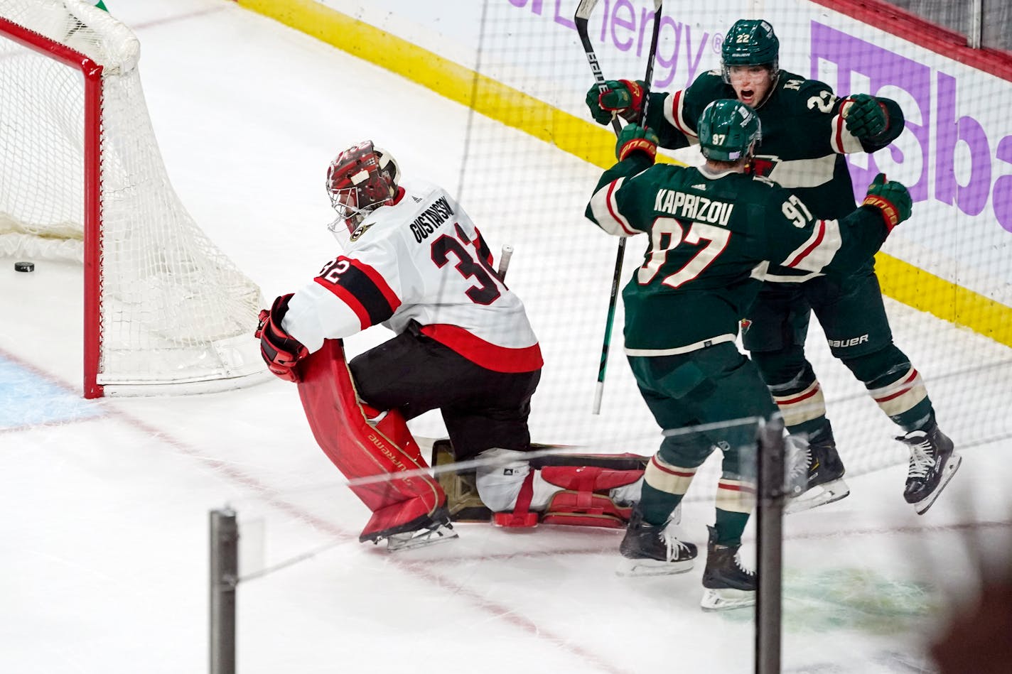 Minnesota Wild's Kevin Fiala (22) and Kirill Kaprizov (97) celebrate Kaprizov's overtime goal against Ottawa Senators goalie Filip Gustavsson (32) in an NHL hockey game Tuesday, Nov. 2, 2021, in St. Paul, Minn. (AP Photo/Jim Mone)