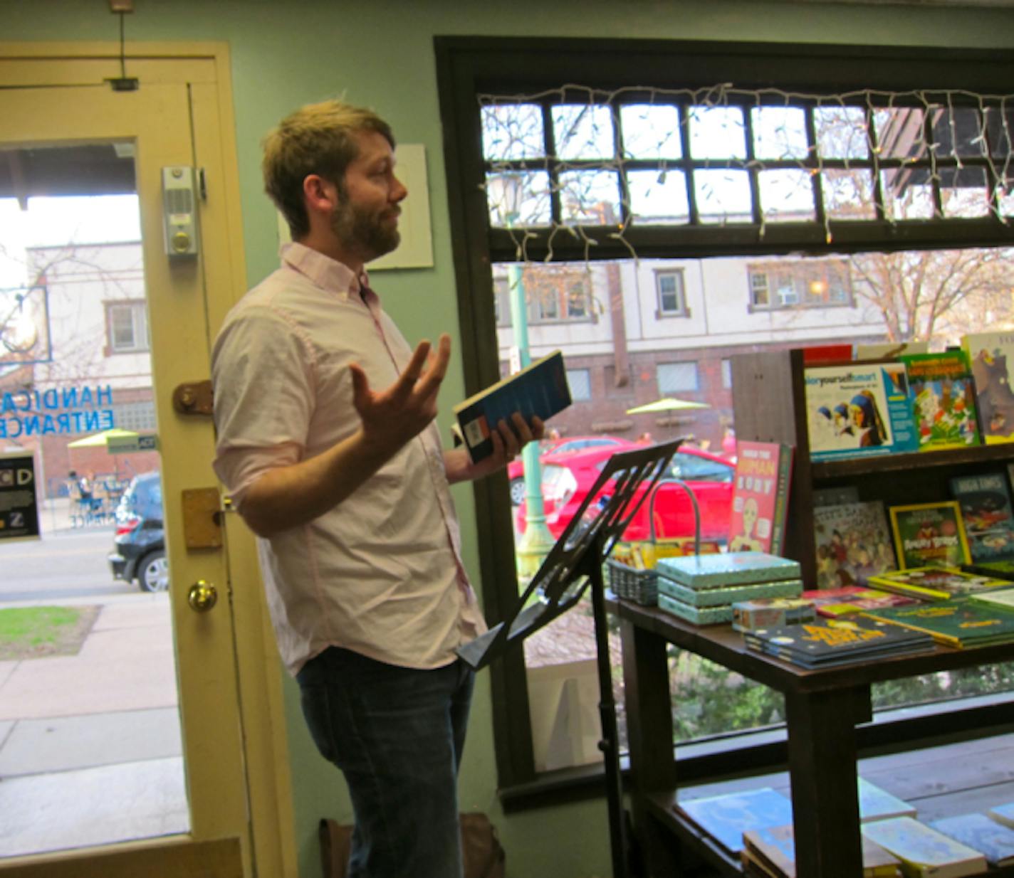 Ethan Rutherford reads from "The Peripatetic Coffin" at his book launch at Micawber's.