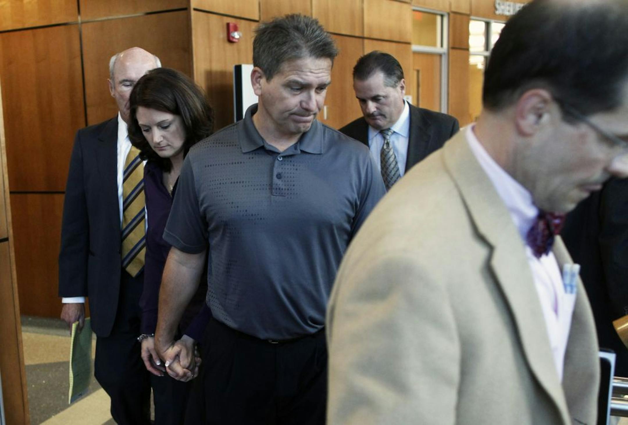 Minnesota State football coach Todd Hoffner, center