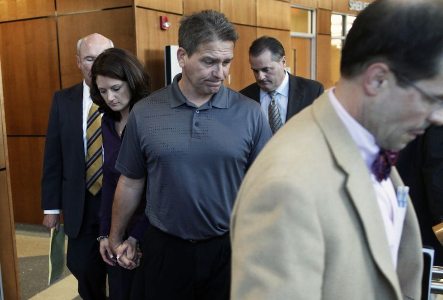 Minnesota State football coach Todd Hoffner, center