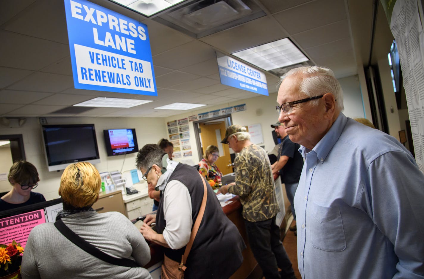 Vehicle owners waited in line in South St. Paul at the Quick-Serv License Center.