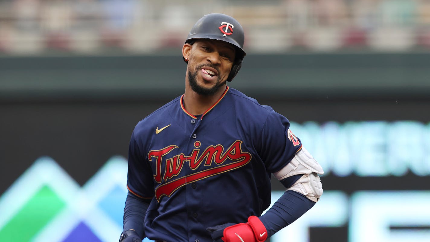 Minnesota Twins' Byron Buxton smiles while running the bases after hitting a home run during the first inning of a baseball game against the Tampa Bay Rays, Friday, June 10, 2022, in Minneapolis. (AP Photo/Stacy Bengs)