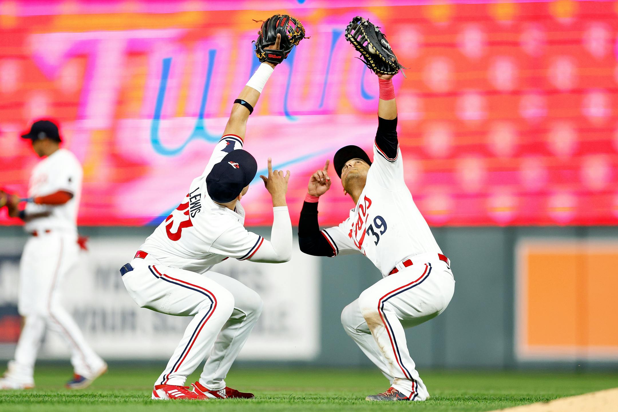 Royce Lewis (23) and Donovan Solano (39) of the Minnesota Twins celebrate their victory against the Texas Rangers after the game at Target Field on Aug. 25, 2023, in Minneapolis, Minnesota. The Twins defeated the Rangers 12-2. (David Berding/Getty Images/TNS) ORG XMIT: 88334667W