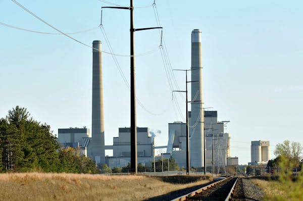 File- This Oct. 20, 2010, file photo shows Xcel Energy's Sherco Power Plant in Becker, Minn. Minnesota, which already successfully lowered carbon emis