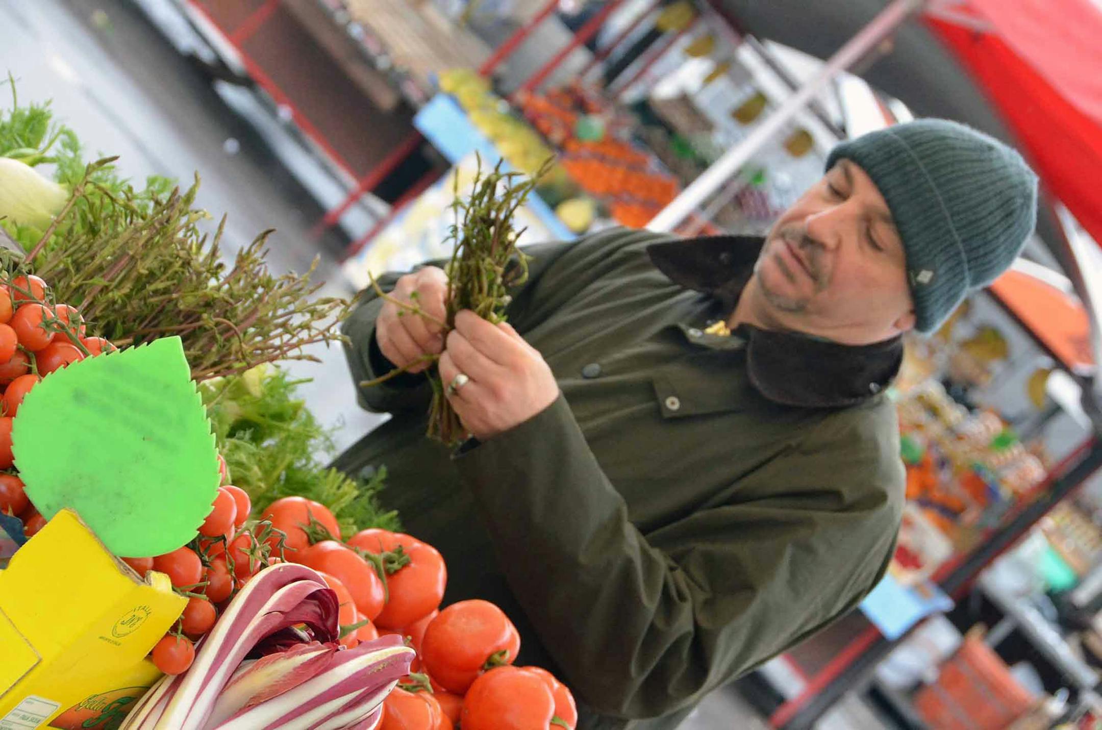Photos by Christopher Wurst Lenny Russo at the market on a rainy day in Slovenia.