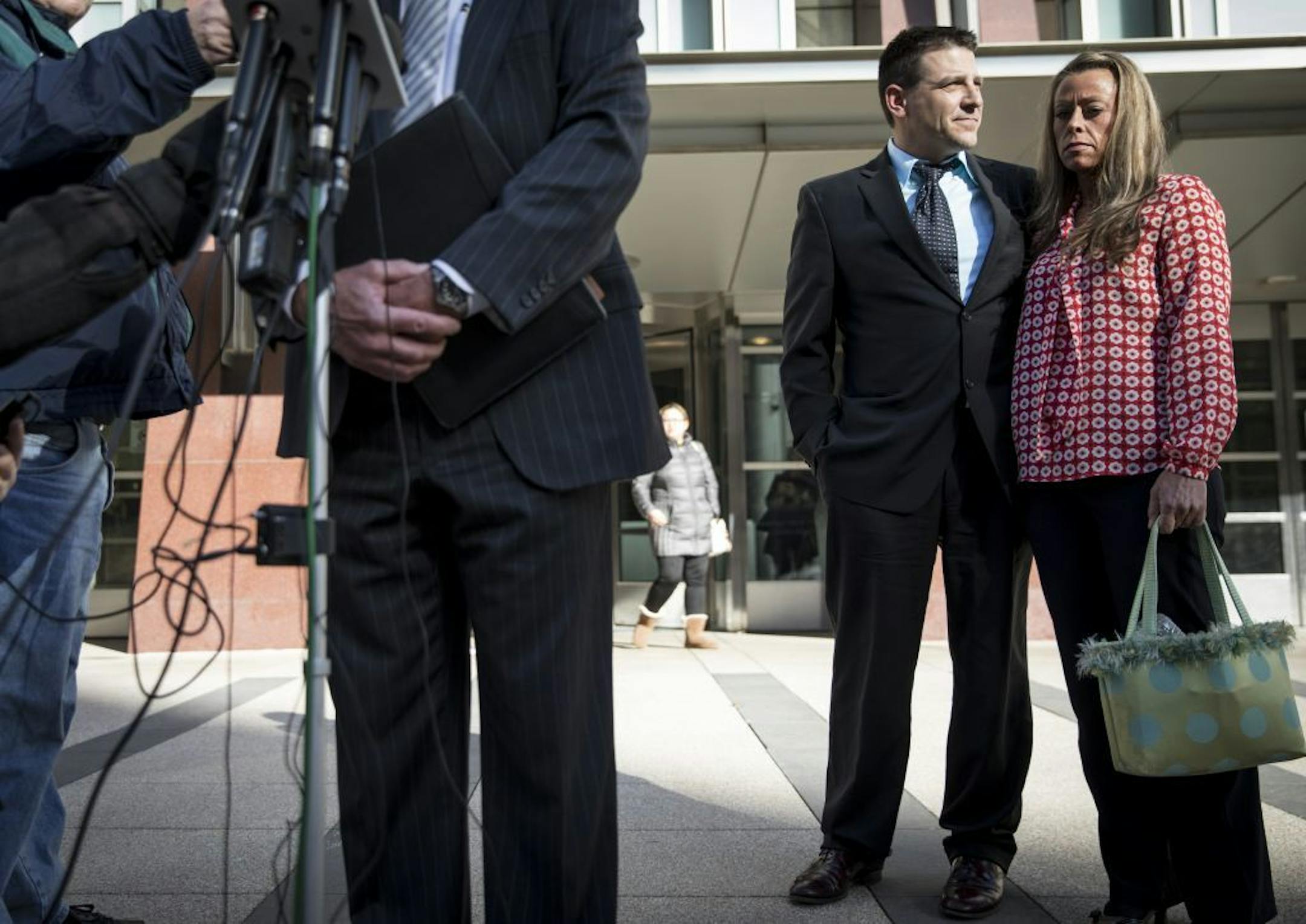 Jared Scheierl, with his girlfriend Stacy Liestman, listened to the Wetterling's attorney Doug Kelley speak to the media outside the U.S. Courthouse on Monday morning shortly after addressing Danny Heinrich at the sentencing. on November 21, 2016, in Minneapolis, Minn.