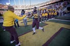 Minnesota's running back Kobe McCrary was greeted by Head Coach P. J. Fleck as the seniors were recognized before Minnesota took on Wisconsin at TCF B