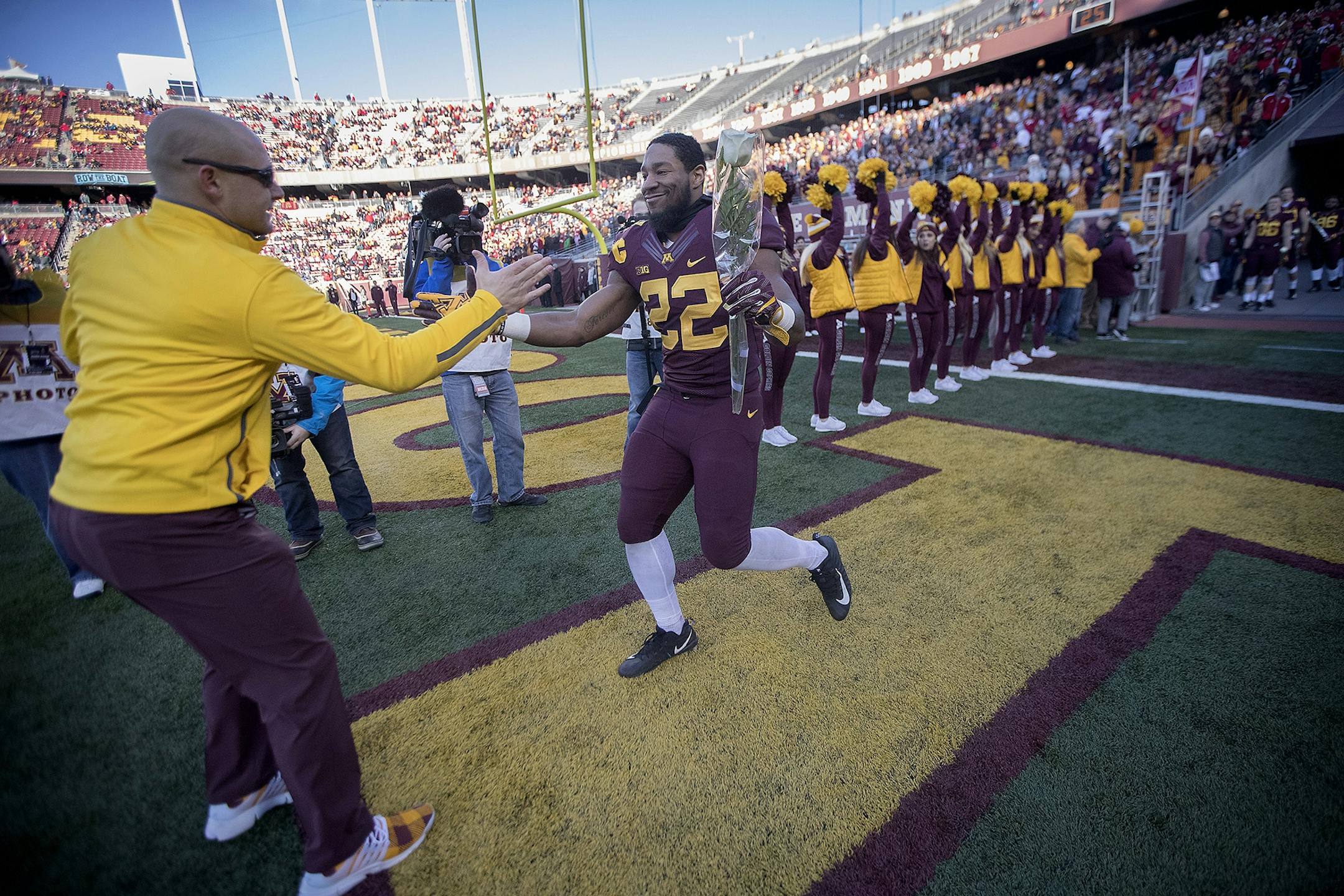 Minnesota's running back Kobe McCrary was greeted by Head Coach P. J. Fleck as the seniors were recognized before Minnesota took on Wisconsin at TCF Bank Stadium, Saturday, November 20 2017 in Minneapolis, MN.