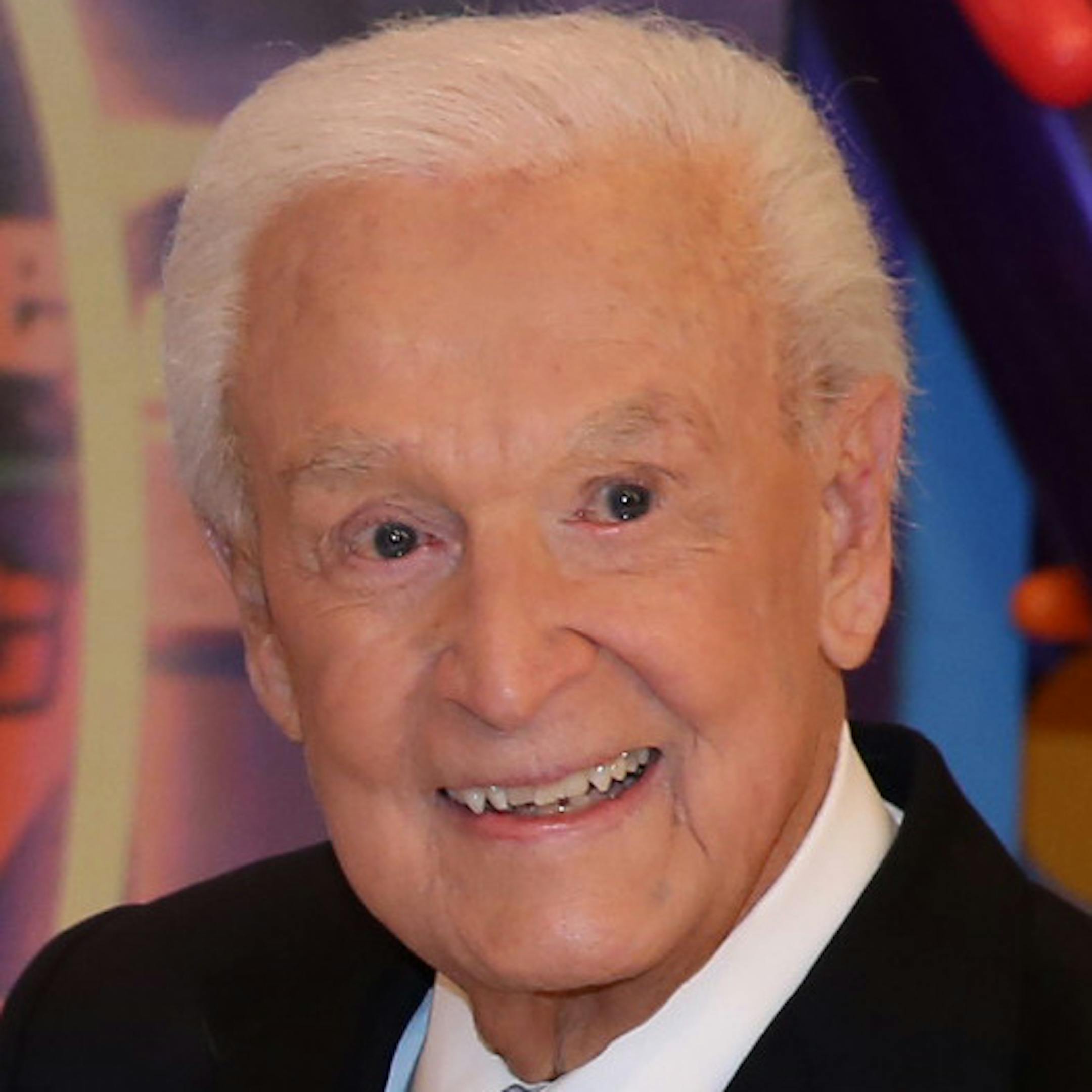 This Nov. 5, 2013 photo shows Bob Barker posing on the set of "The Price is Right" with a cake celebrating his 90th birthday at CBS Studios in Los Angeles. The veteran game show host, at the helm of ìThe Price is Rightî from 1972 to 2007, was invited back by current host Drew Carey on Thursday, Dec. 12, to celebrate the milestone birthday. (Photo by Matt Sayles/Invision/AP, File)