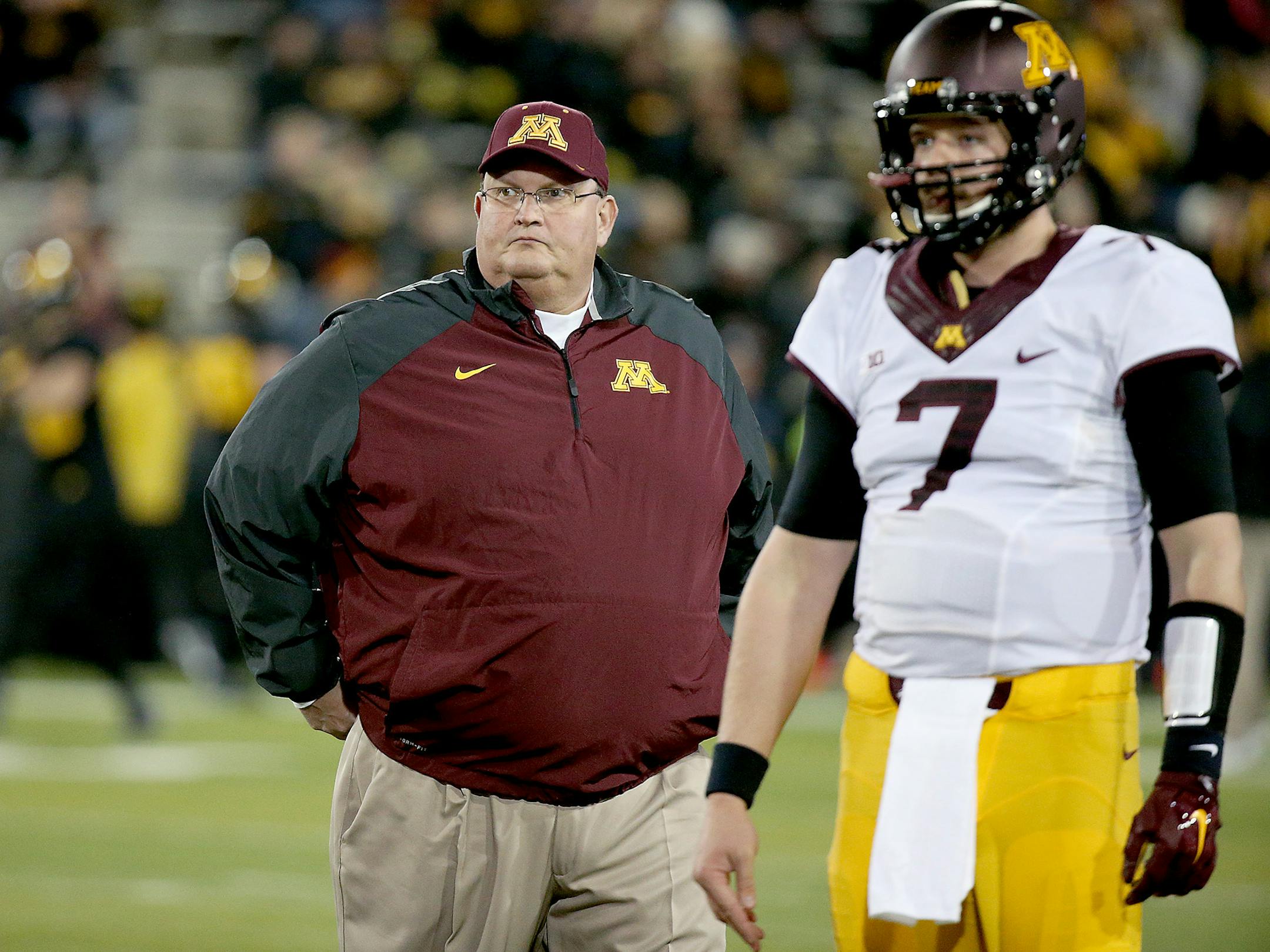 Gophers football coach Tracy Claeys, seen here with now-departed quarterback Mitch Leidner, continues to recruit despite uncertainty about his future employment.