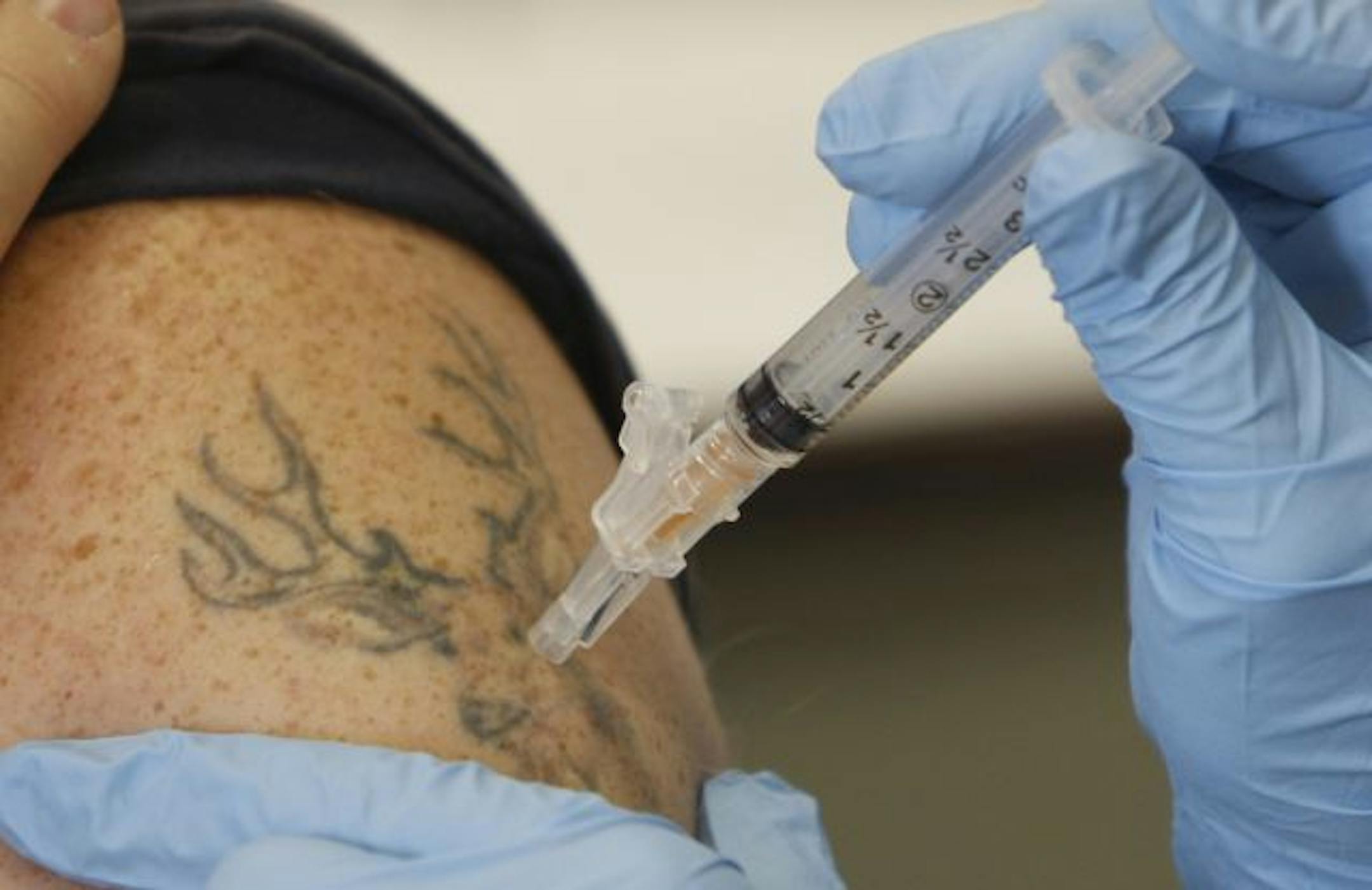 Photo: Patience receives a vaccine.