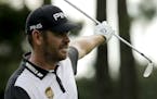 Louis Oosthuizen of South Africa, reacts on the ninth hole during the third round of the PGA Championship golf tournament at the Quail Hollow Club Sat