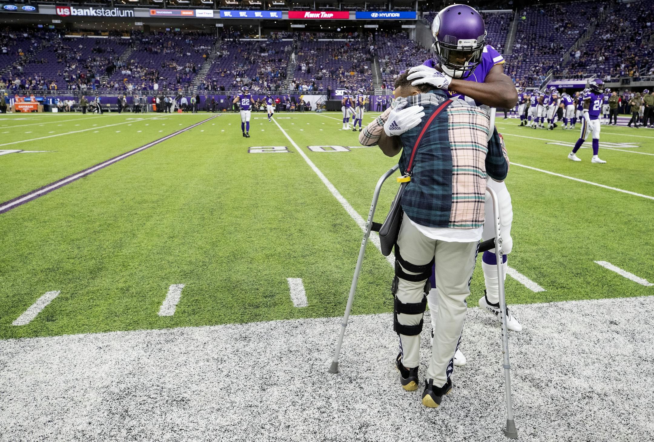 Injured Vikings cornerback Mike Hughes got a hug from Xavier Rhodes during pregame warmups.