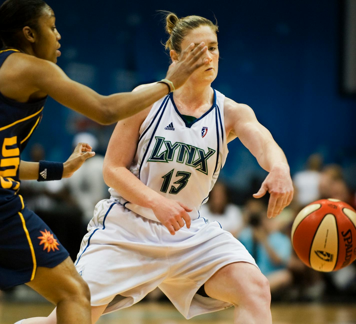 Lindsay Whalen passes the ball to a teammate