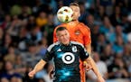 Minnesota United midfielder Robin Lod heads the ball in front of a Houston Dynamo counterpart Saturday night during the Loons' 2-1 home loss.