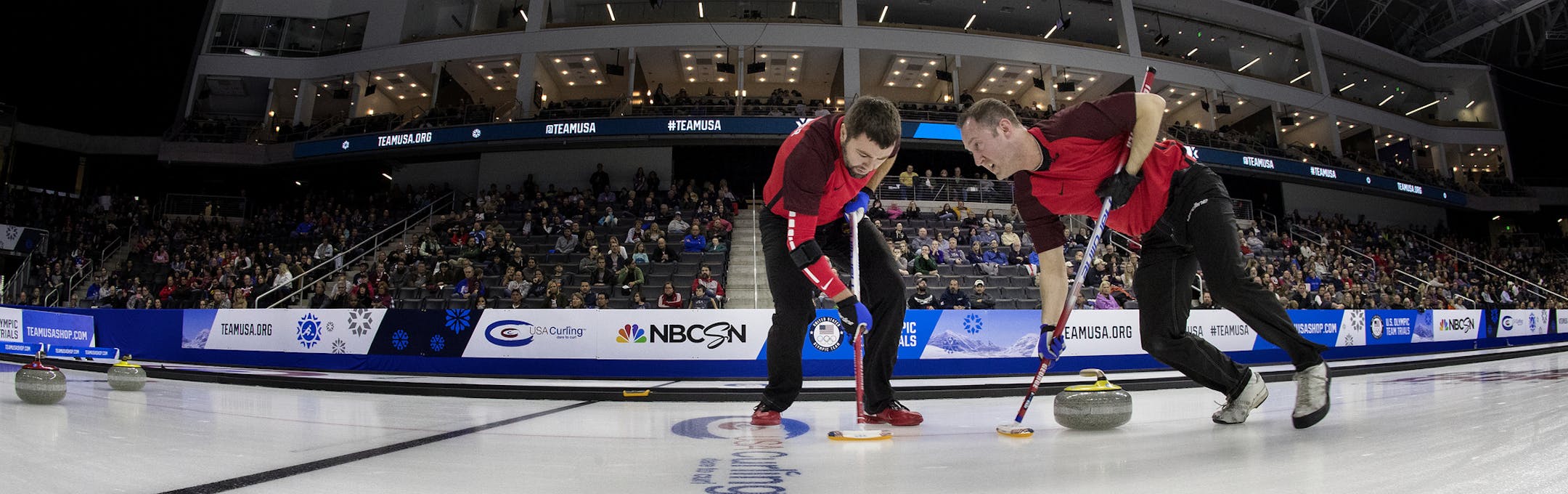John Landsteiner (Duluth, Minn.) and Tyler George (Duluth, Minn.) of Team Shuster swept in front of the rock during Friday action at the U.S. Olympic curling team trials. Team Shuster beat Team McCormick 9-4 to tie the series. ] CARLOS GONZALEZ • cgonzalez@startribune.com - November 17, 2017, Omaha, NE, Baxter Arena, US Olympic curling trials, Team McCormick vs. Team Shuster